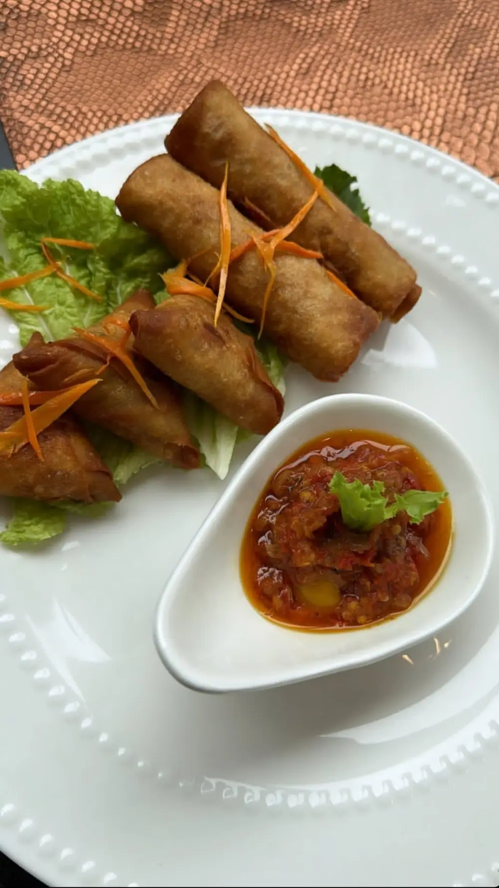 Spring rolls and samosa with pepper dip